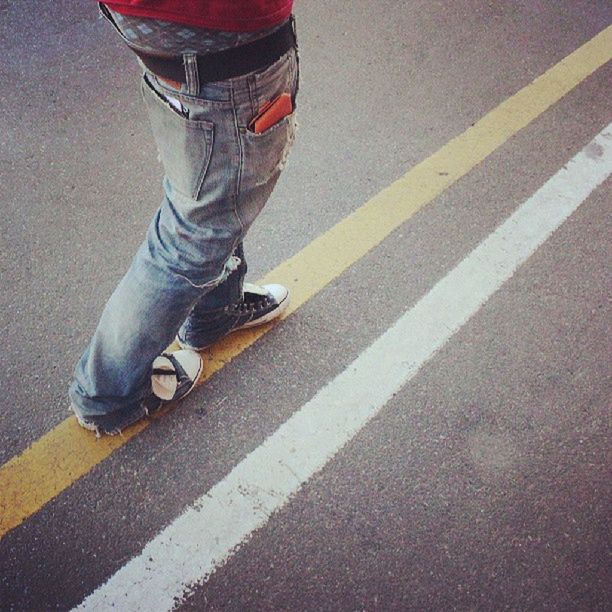 street, road, low section, high angle view, road marking, transportation, asphalt, shoe, person, shadow, sidewalk, sunlight, day, outdoors, red, footwear, standing, zebra crossing