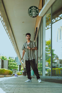 Low section of man walking on street