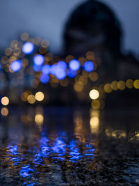 Defocused image of illuminated lights at night