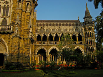 Facade of historic building against clear sky