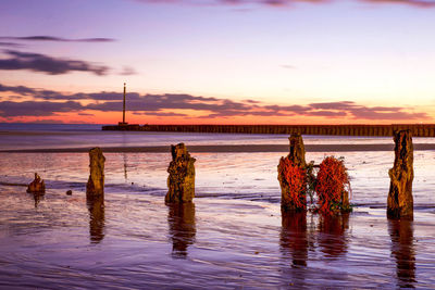 Scenic view of sea against sky at sunset