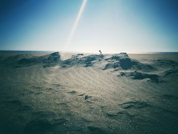 Scenic view of beach against clear sky