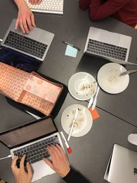 High angle view of man using laptop on table