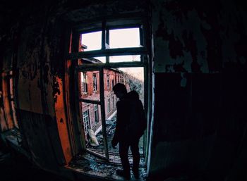 Silhouette man in abandoned building