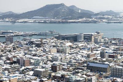 High angle view of city by sea