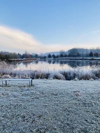 Scenic view of frozen lake against sky