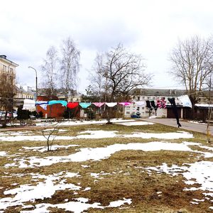 Snow on field against sky during winter