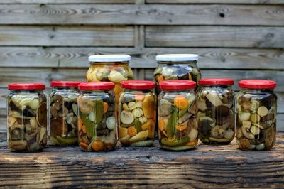 Various fruits in jar on table