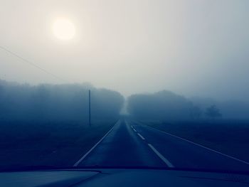 Road against sky during foggy weather