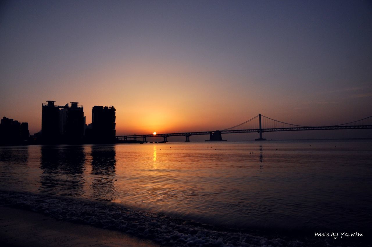 VIEW OF SUSPENSION BRIDGE IN CITY