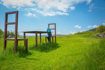 Man on field against sky