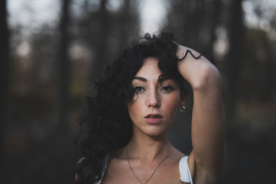 Portrait of young woman in forest