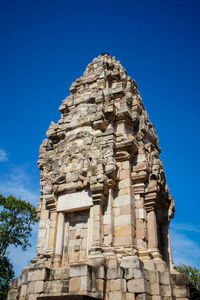 Low angle view of historical building against blue sky