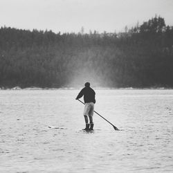 Silhouette of woman in water