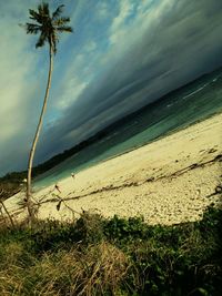 Scenic view of sea against cloudy sky