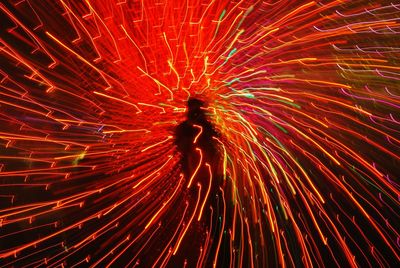 Low angle view of firework display at night