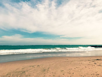 Scenic view of beach against sky