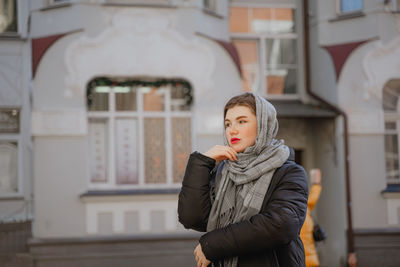 Young woman standing in city