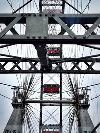 Low angle view of ferris wheel against sky