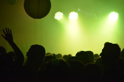 Silhouette people at music concert