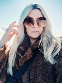 Portrait of young woman wearing sunglasses