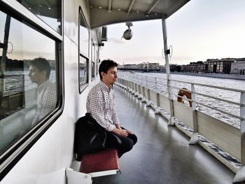 Man sitting on a nautical vessel