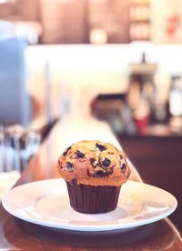 Close-up of cup cake in plate on table