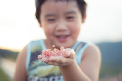 Close-up portrait of boy eating food