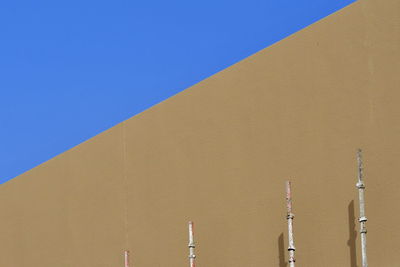 Low angle view of building against blue sky