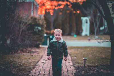 Boy standing outdoors