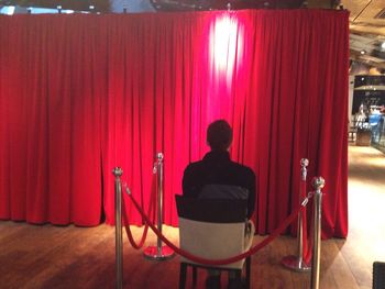 Rear view of a man in a mirror