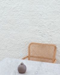 Empty chairs against wall