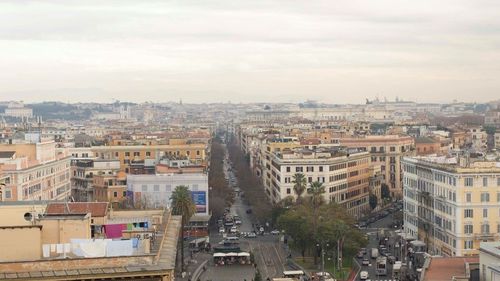 High angle view of buildings in city against sky