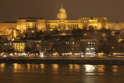 Illuminated buildings at waterfront