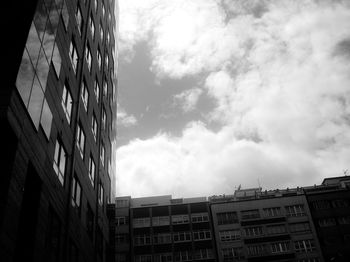 Low angle view of building against cloudy sky