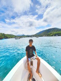 Portrait of man in sea against sky