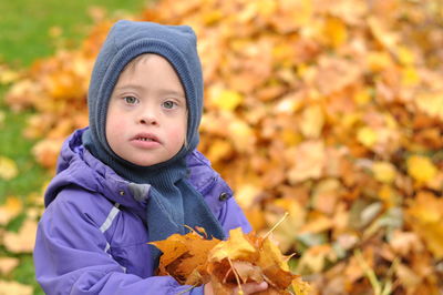 Close-up of cute baby girl during autumn