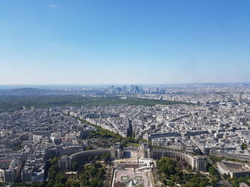 High angle view of city against clear blue sky