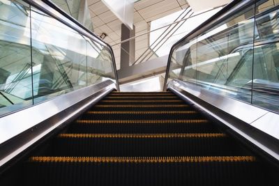 Low angle view of escalator in building