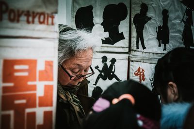 Portrait of woman holding text