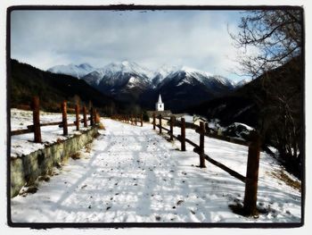 Scenic view of snow covered mountains against sky