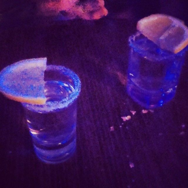 refreshment, drink, food and drink, drinking glass, indoors, freshness, close-up, transparent, glass - material, still life, blue, water, bubble, glass, table, studio shot, ice cube, liquid, alcohol, bottle