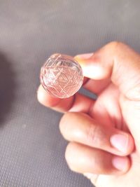 Close-up of hand holding coins