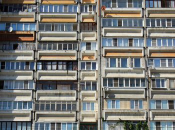 Background of windows and balconies of a multi-storey building