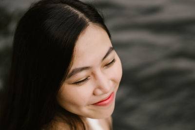 Close-up of smiling young woman