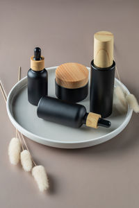 Set of natural organic cosmetics on ceramic tray. face moisturizer cream in eco friendly bamboo jar