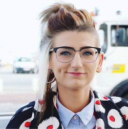 Portrait of smiling young woman in car