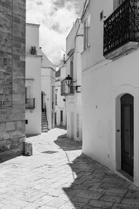 Street amidst buildings against sky