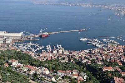 High angle view of buildings by sea