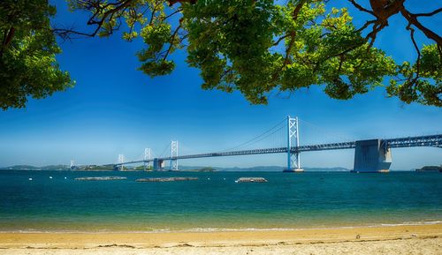 View of suspension bridge over sea